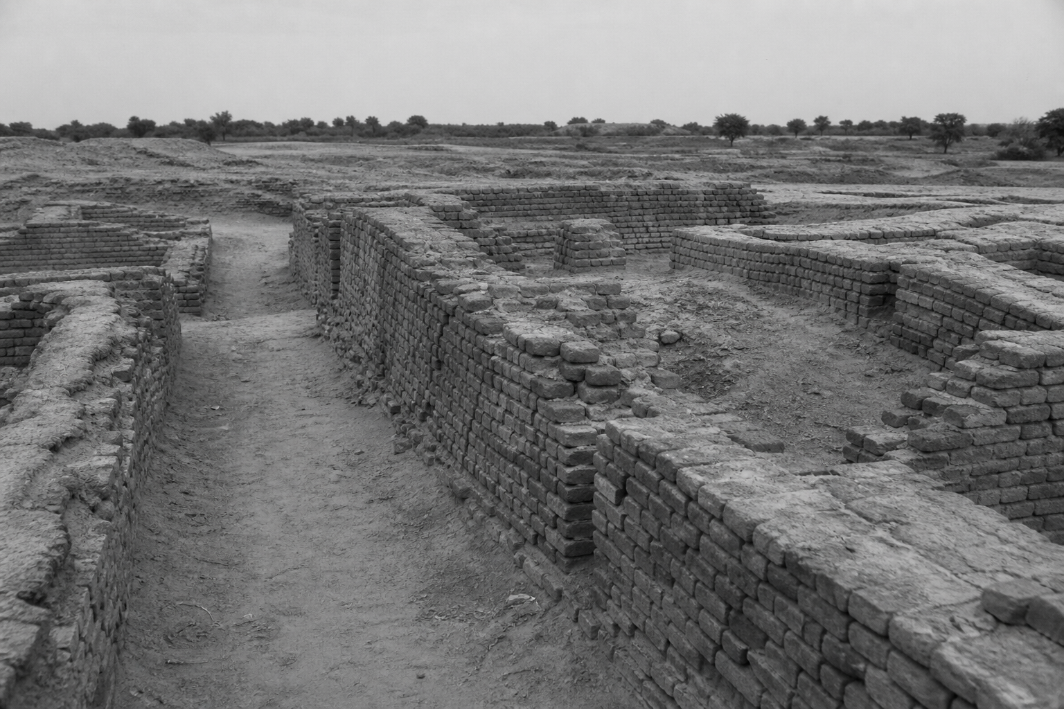Weathered brick lanes, inspired by Indus archaeology. Contemporary AI illustration.